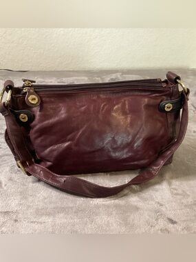 vintage Stone Mountain leather shoulder bag in a deep maroon/burgundy shade